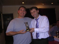 Richie Wienburg presenting the 1st XI Player of the Season Awards to Saul Weitzman